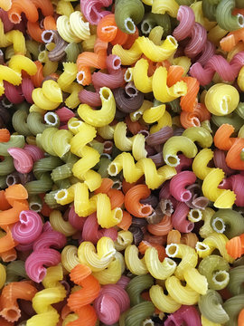 Multicolored curly-shaped pasta spirals