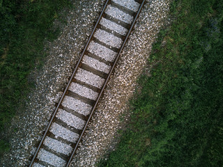 Obraz premium Aerial view of railway track through countryside, drone top view