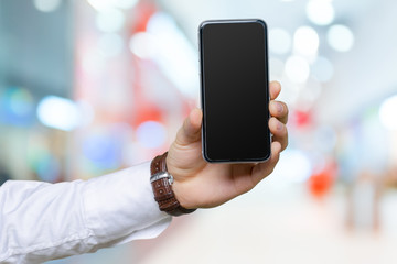 Close up of a man using mobile smart phone