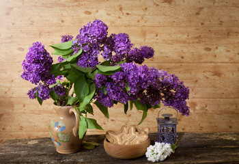 Still life with a bouquet of lilacs