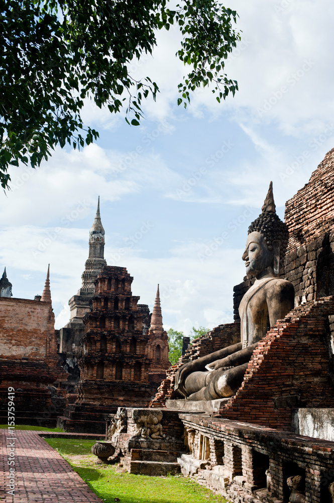 Wall mural Sukhothai historical park the old town of Thailand Ancient Buddha Statue at Wat Mahathat in Sukhothai Historical Park,Thailand