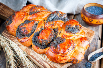 Puff pastry with poppy on a wooden board, horizontal
