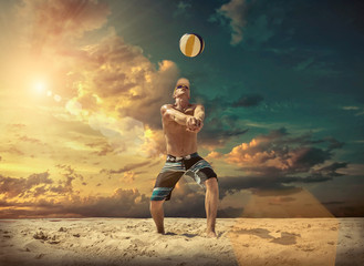 Beach volleyball player in action at sunny day under blue sky.