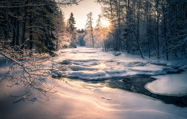 Scenic landscape with flowing river at winter morning