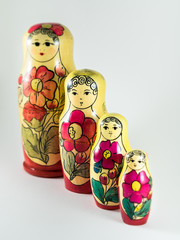Matryoshka doll family against white background