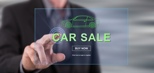 Man touching a car sale concept on a touch screen