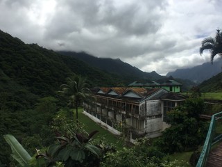 Fototapeta na wymiar Discarded hotel in the mountains of Papenoo valley, shot during a safari tour, Tahiti, French Polynesia