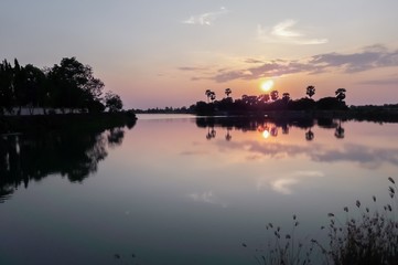 Sunset behind the pond