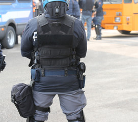 Riot police officer and bulletproof vest during a protest
