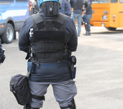 Riot police officer and bulletproof vest during a protest