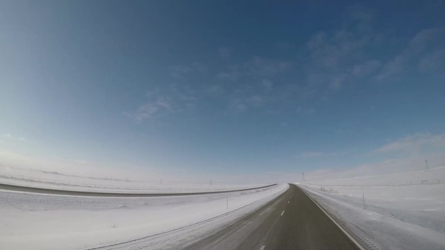 Dashcam Footage From An Elevated Position On A Rural Highway In The US State Of MONTANA During Winter.