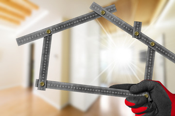 Interior design concept - Metal ruler in the shape of house
