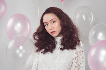 Asian beauty fashion woman with pastel balloons