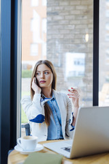 Beautiful Young Woman Talking on the Phone