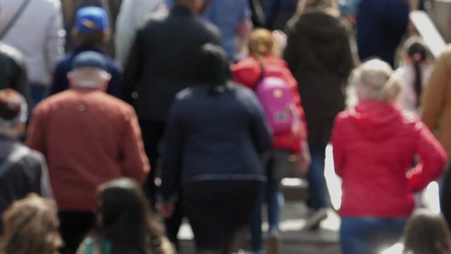 Slow motion footage with blur of thick crowd of people.
