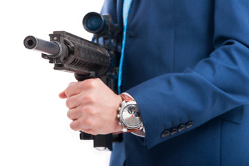 Dangerous killer holding machine gun shoot in closeup