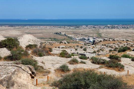 Qobustan park of prehistorical petroglyphs near Caspian sea. View on prison of Azerbaijan