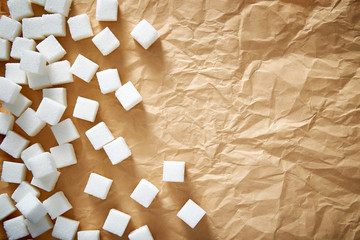 Sugar cubes on brown