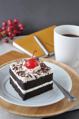 Black Forest Cake on Plate with Hot Coffee