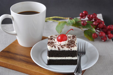 Dish of Black Forest Cake with Cup of Coffee