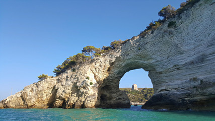 Fototapeta na wymiar San Felice arch (Architello) from boat, Gargano coast, Vieste, Italy