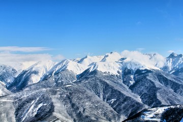 Fototapeta na wymiar The Caucasian mountain range. Krasnaya Polyana mountain resort