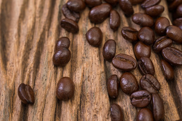 Roasted coffee bean on wood background
