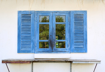 Wooden window of country house.