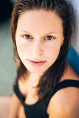 Portrait of young beautiful sexy woman with wet hair on the beach