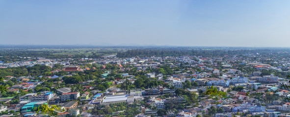 Cityscape view from top of the hill or mountain with white cloud and blue sky, view from top of Khao Sakae Krang mountain, Uthai Thani province, Thailand