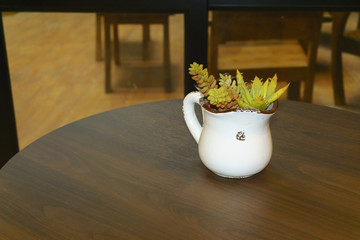 wooden table in front of blurred background in cafe