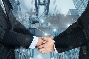 Double Exposure of a businessman handshake  with Map global partner connection of Container Cargo freight ship for Logistic Import Export background (Elements of this image furnished by NASA)