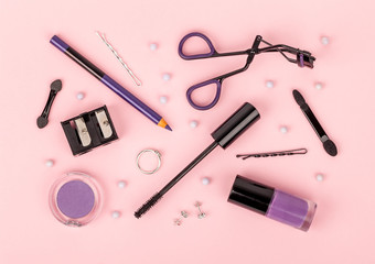 set of professional decorative cosmetics, makeup tools and accessory on pink background. beauty, fashion and shopping concept. flat lay composition, top view