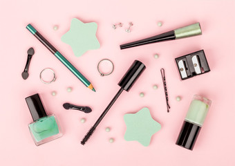 set of professional decorative cosmetics, makeup tools and accessory on pink background. beauty, fashion and shopping concept. flat lay composition, top view