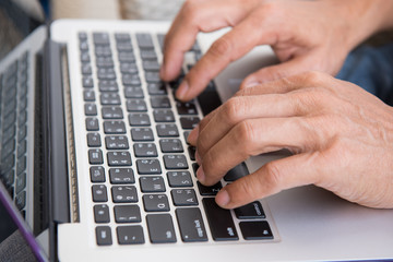 Man working at computer on desk. hands close up shot