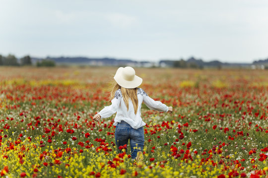 Woman walking in a flower field