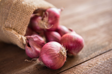 Red onion on a wooden table