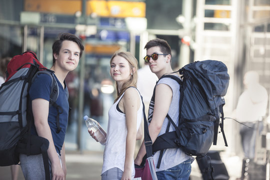 Young people traveling with backpacks, exploring Berlin