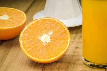 glasses of fresh orange juice/freshly orange juice in a glass on table