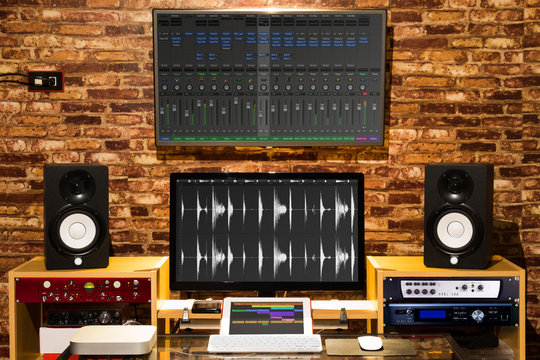 digital sound studio, music computer recording & editing equipment in loft design interior working space