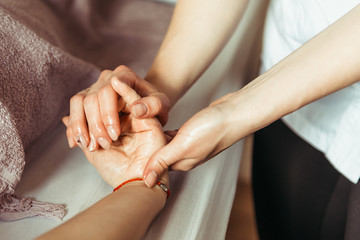 Obraz na płótnie Canvas physical therapist massaging hands