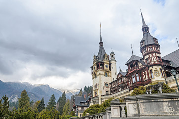 Fototapeta premium ROMANIA, SINAIA - APRIL 4, 2017: The Peles Castle from Sinaia Romania, Carpathian Mountains
