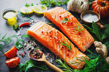 Fresh salmon fillet with aromatic herbs, spices and vegetables