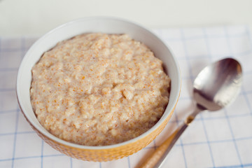 bowl of oatmeal and spoon