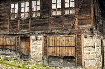 Weathered wooden boards facade of old countryhouse