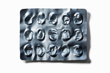 Close up of popped blister pack of pills