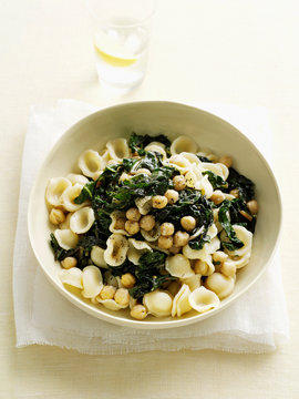 Bowl of pasta with spinach and beans
