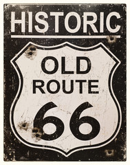 Sepia effect retro sign for the historic old Route 66 in America.  Faded, vintage style with bullet holes.  - obrazy, fototapety, plakaty