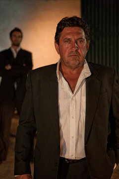 Man wearing suit outdoors at night
