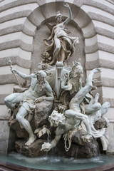 Naklejka premium Fountain the Power of the Sea near the Hofburg Palace in Vienna, Austria